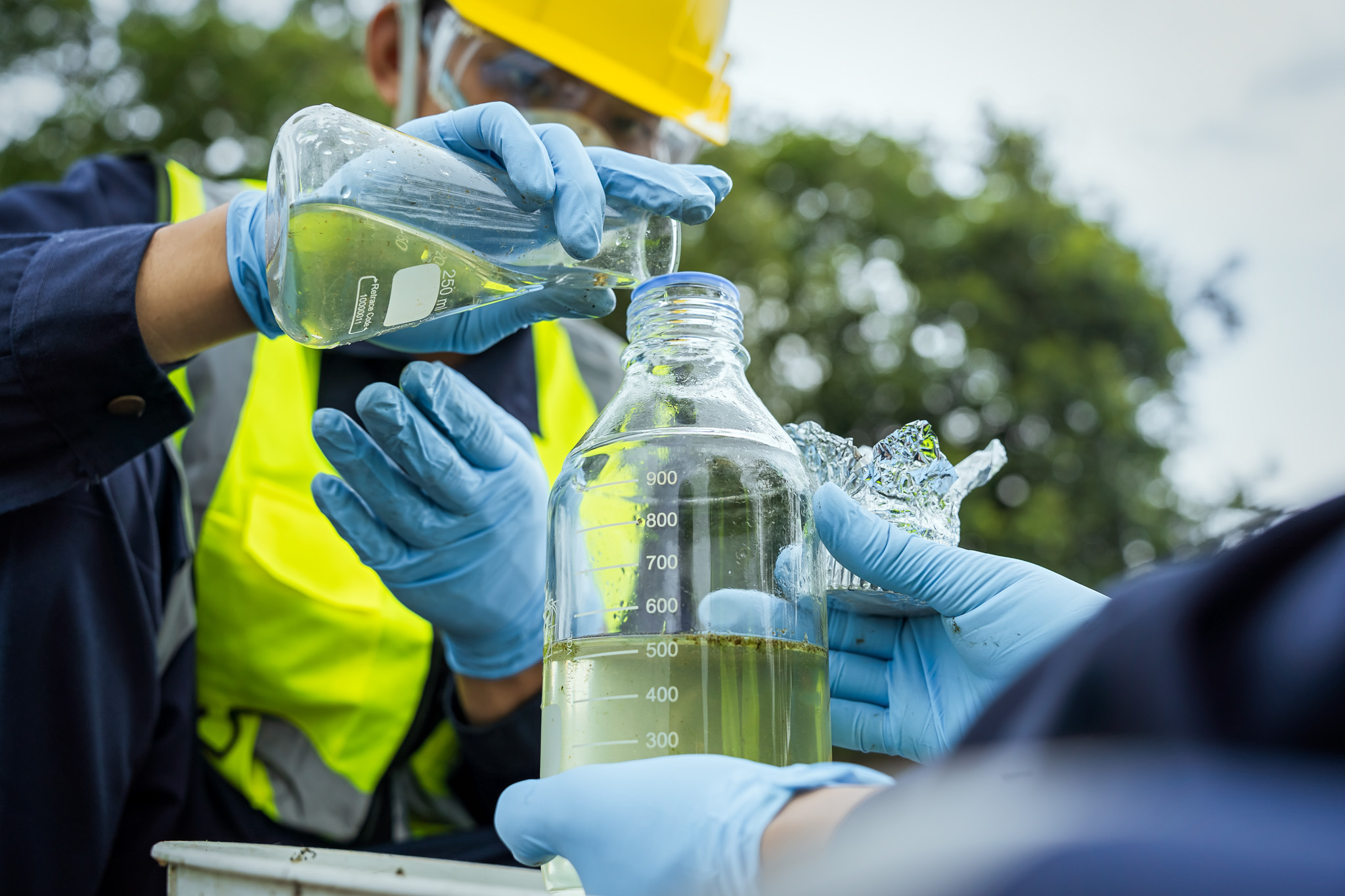 Environmental researchers investigate the condition of canal wat Environmental researchers investigate the condition of canal water